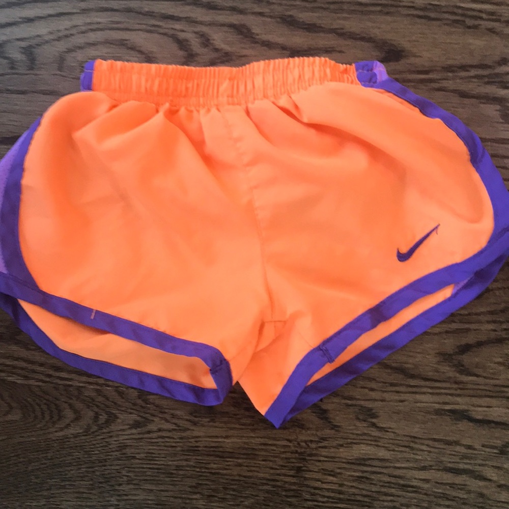 Orange and purple Nike shorts